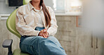 Woman, patient and hands with anxiety for dental surgery, tooth extraction or pain relief at clinic. Closeup, female person or customer waiting in anticipation, stress or nervous for dentist on chair