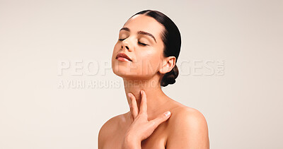 Buy stock photo Woman, touch and skincare with glow in studio for clear skin, natural beauty and smooth texture. Mockup space, person and facial shine of dermatology cosmetics, treatment results and white background