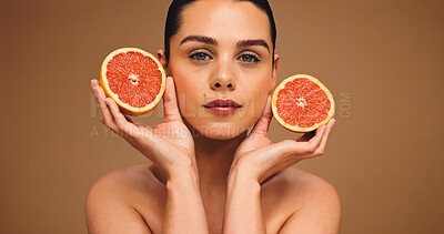 Buy stock photo Woman, portrait and grapefruit for skincare in studio, organic cosmetics or vitamin C with natural self care. Female person, dermatology and fruit for healthy skin, beauty and wellness on background
