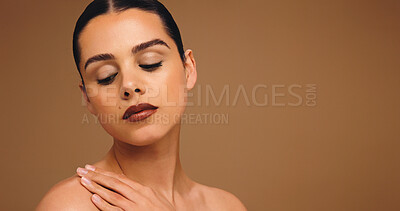 Buy stock photo Woman, touch shoulder and skincare in studio, mockup space and glow with results on background. Person, model and eyes closed for wellness, beauty and cosmetics with makeup, change and dermatology