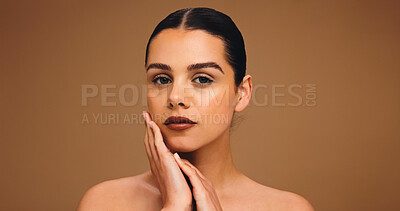 Buy stock photo Beauty, touch and portrait of woman in studio for cosmetics, transformation and makeup. Mockup space, salon and person with confidence, facial glow and aesthetic for skincare on brown background