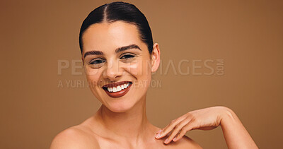 Buy stock photo Cosmetology, beauty portrait and woman in studio with natural makeup, cosmetics and lipstick. Mockup space, happy girl and foundation on brown background for skin coverage, healthy glow and skincare