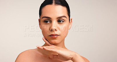 Buy stock photo Thinking, skincare and woman in studio, dermatology and grooming on white background. Mockup space, shine and person with confidence, beauty and natural cosmetics with glow, wellness and aesthetic