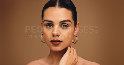 Buy stock photo Portrait, earrings and woman with makeup in studio for aesthetic, glow or brown background. Beauty, skin wellness and model with lipstick cosmetics, face transformation or confidence with makeover