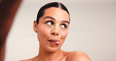 Buy stock photo Skincare, selfie and woman with tongue out, studio or profile picture on social media and cosmetics. Beauty, photography and dermatology for healthy skin, glow and white background or mockup space