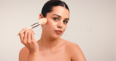 Buy stock photo Girl, makeup brush and portrait with beauty in studio, powder and application with pride on background. Woman, cosmetic tools and foundation with skin, confidence and mock up space in New Zealand
