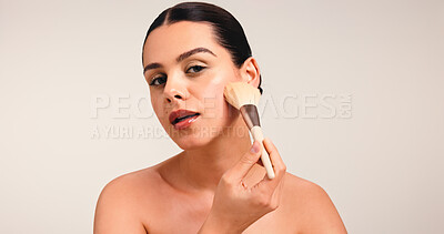 Buy stock photo Girl, makeup brush and portrait with foundation in studio, powder and application with pride on white background. Woman, cosmetic tools and beauty with skin, confidence and mock up space in Australia