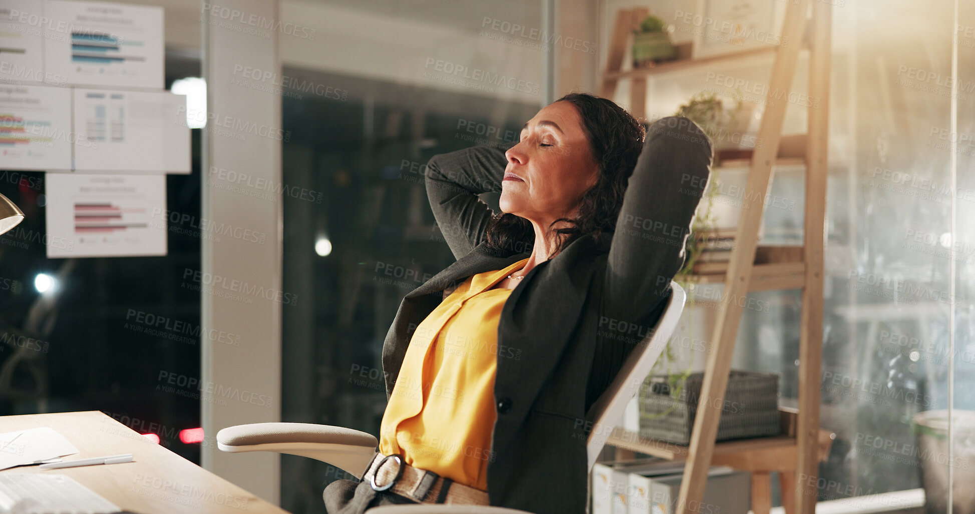 Buy stock photo Break, finance and night with business woman in office to relax or rest after hours, deadline or tasks. Evening, financial and hands behind head with mature employee in workplace for dedication