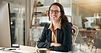 Arms crossed, portrait and smile of woman journalist at desk in office for editing or publication. Coffee, computer and satisfaction with proud employee in professional workplace for journalism