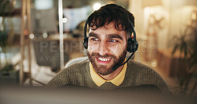 Buy stock photo Call center, night and man with smile, tech and friendly service with headset, talking and help desk. Evening, person and employee in workplace, conversation and customer support with system solution