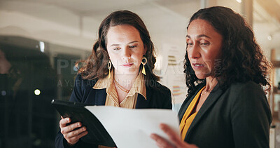 Buy stock photo Talking, paperwork and business women on tablet for planning, budget review and proposal. Corporate, teamwork and people on digital tech for investment research, financial report and meeting at night