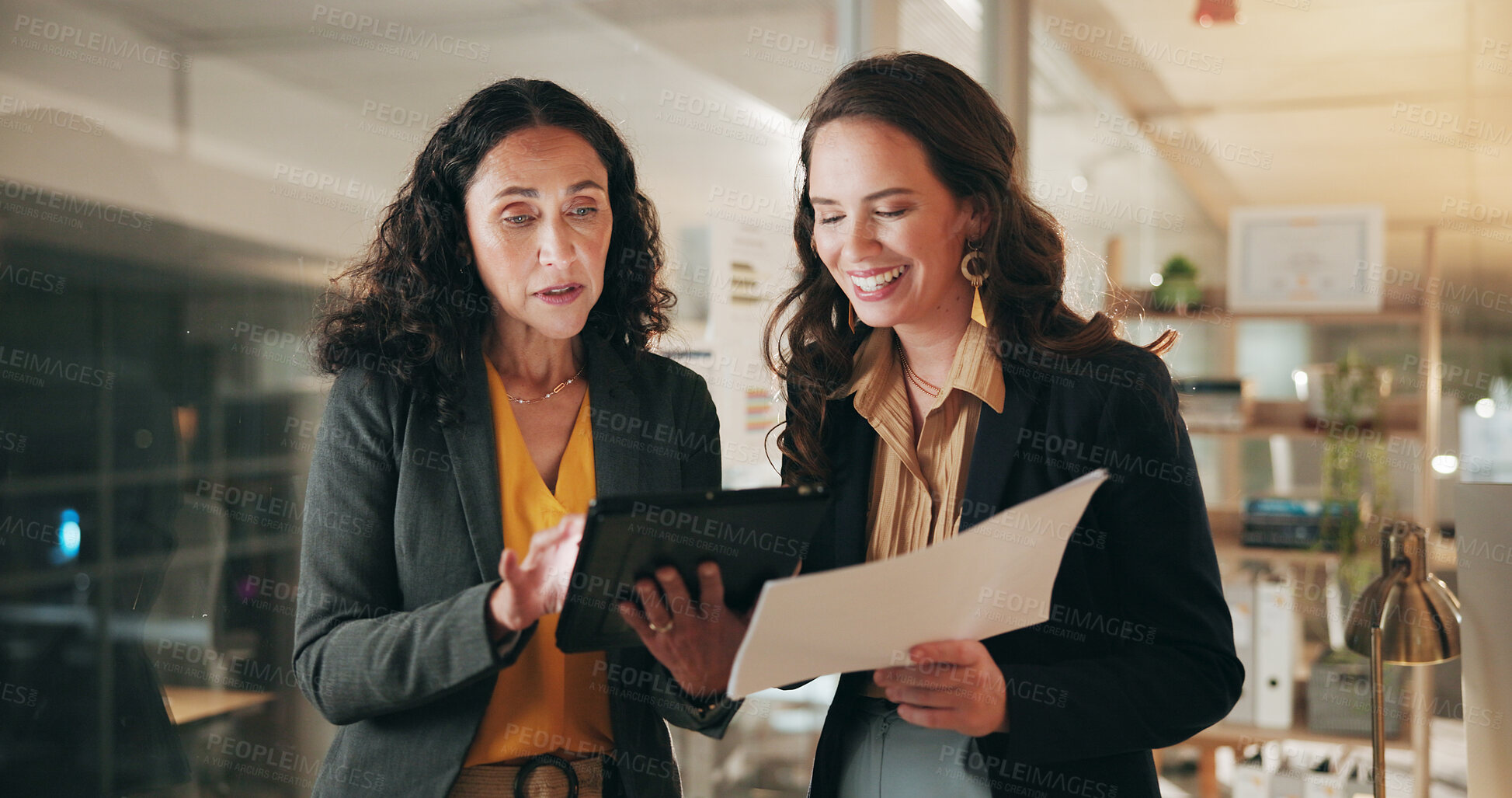 Buy stock photo Office, documents and business women on tablet for planning, budget review and proposal. Corporate, teamwork and people on digital tech for investment research, financial report and meeting at night