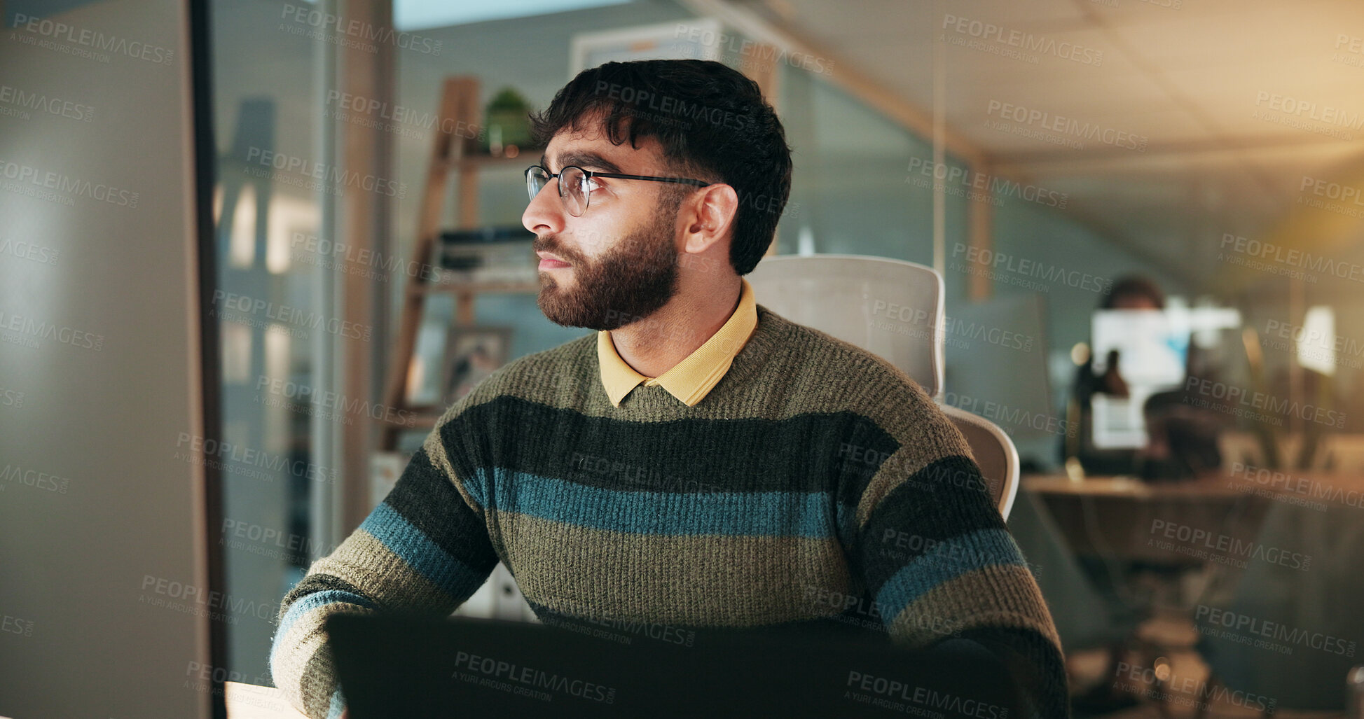 Buy stock photo Serious, man and research on computer in office, deadline or financial analyst with project at night. Employee, working late and person with tech for digital report, online and budget on website