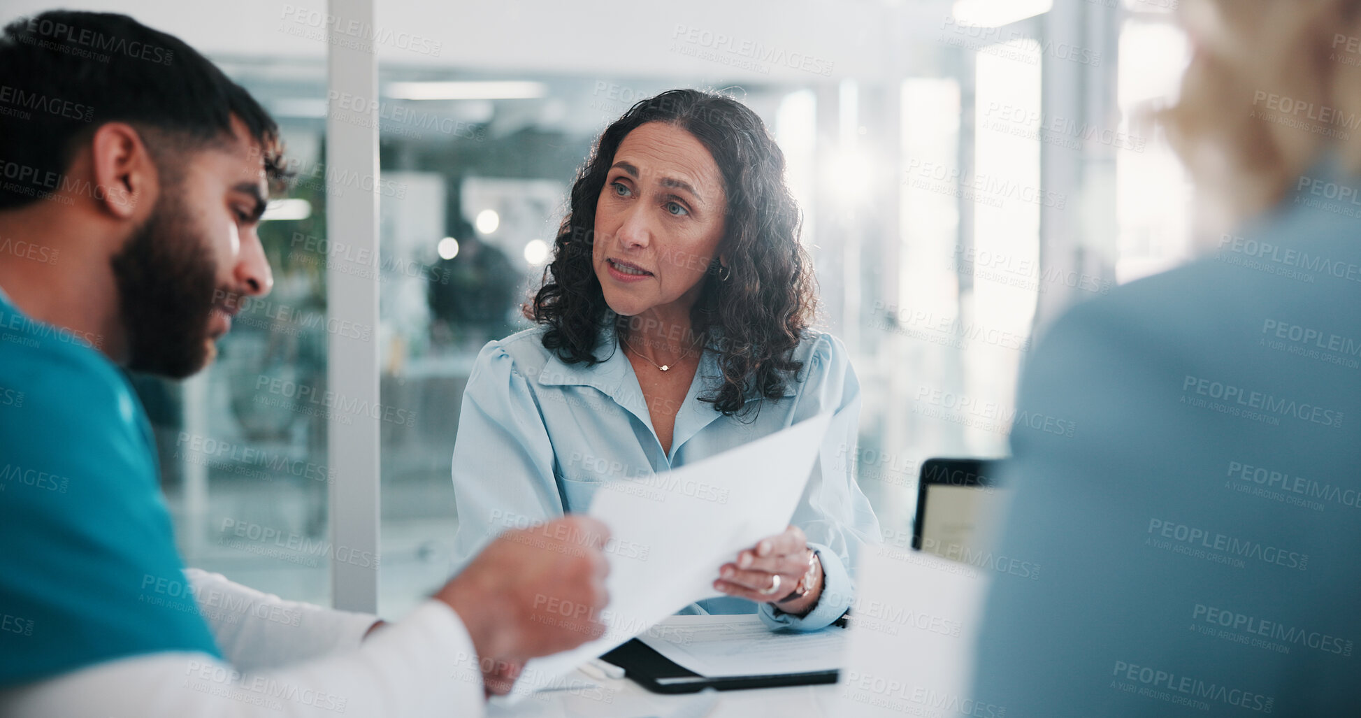 Buy stock photo Doctor, documents and people in hospital, meeting and medical planning with performance review. Advice, schedule and healthcare professional with discussion, problem solving and clinic results