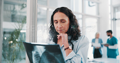 Buy stock photo Woman, doctor or thinking with x ray in hospital for examination, medical procedure or test results. Thoughtful, female person or healthcare professional with MRI radiograph for diagnosis in clinic