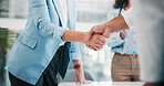 Business, office and people shaking hands in agreement for finance deal, partnership or negotiation. Financial team, investor and handshake at firm for stakeholder approval, company merger and offer