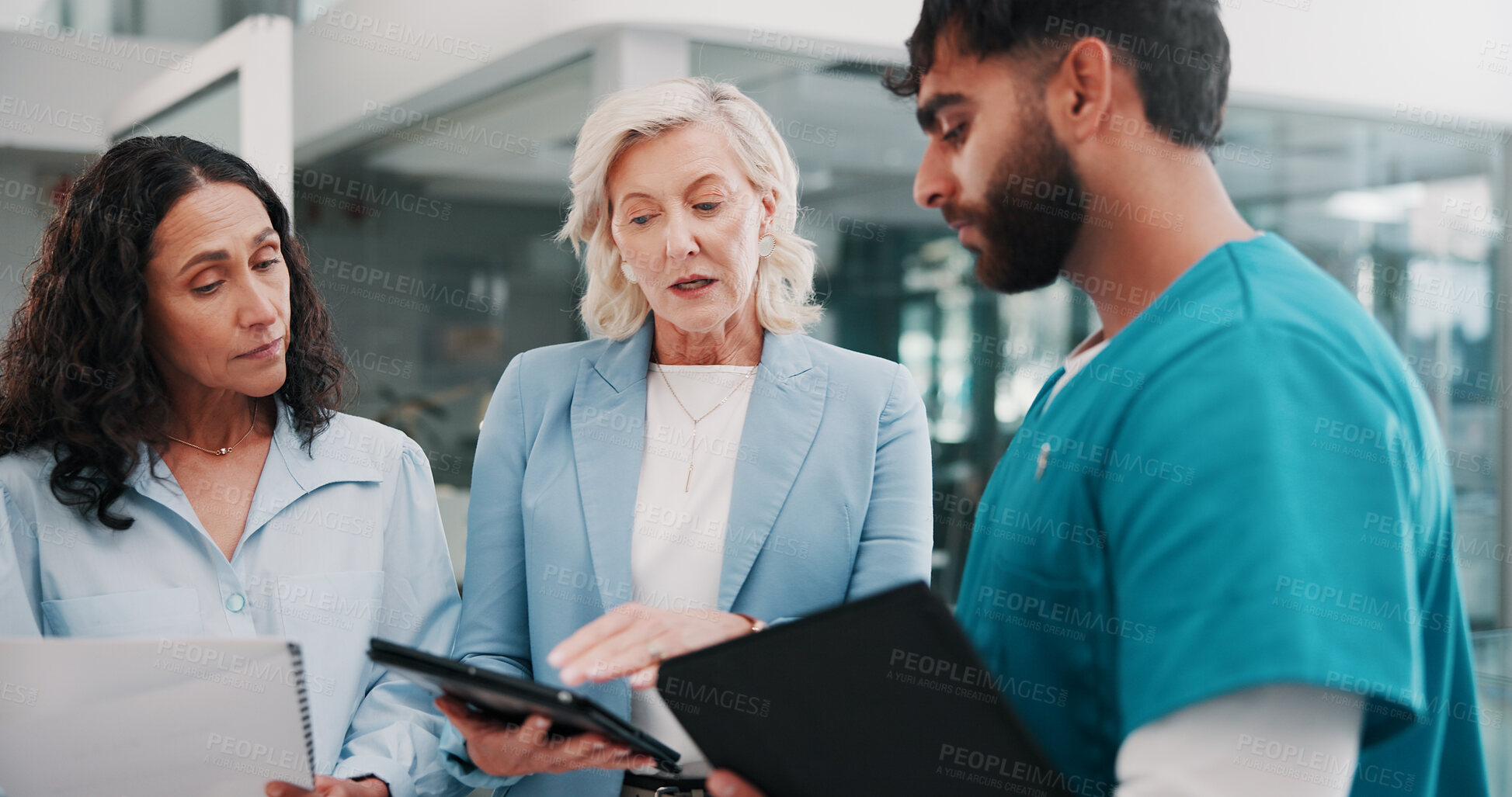 Buy stock photo Communication, hospital management or surgeon with tech, policy development or strategy for quality service. Serious, talk or people in hallway meeting, care standard or budget for healthcare plan