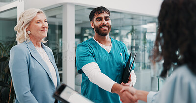 Buy stock photo Handshake, doctor and people in hospital, welcome or onboarding with introduction, smile or hello. Greeting, healthcare or employees with cooperation, shaking hands or partnership with clinic success