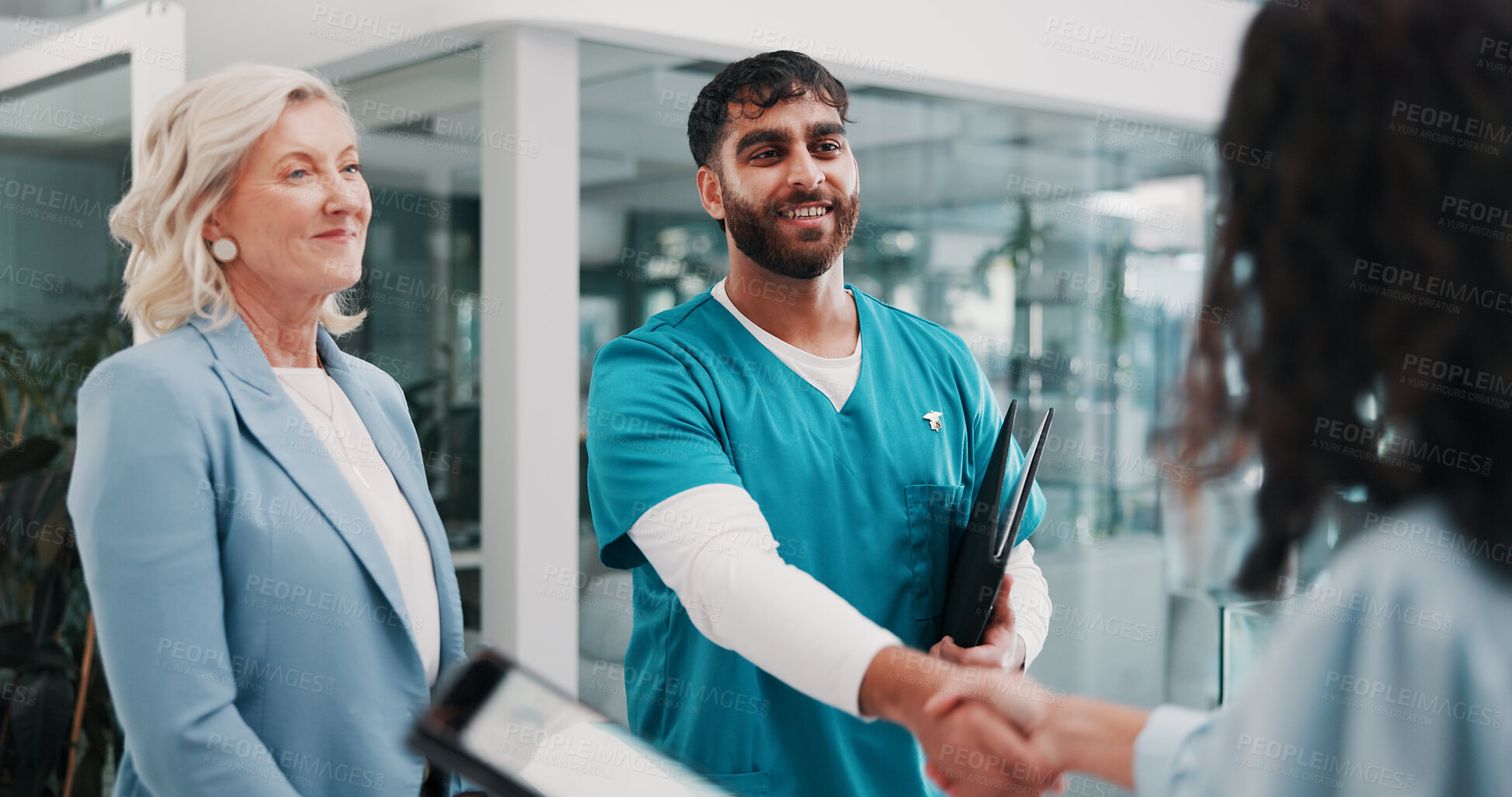 Buy stock photo Handshake, doctor and people in hospital, welcome or onboarding with introduction, smile or hello. Greeting, healthcare or employees with cooperation, shaking hands or partnership with clinic success