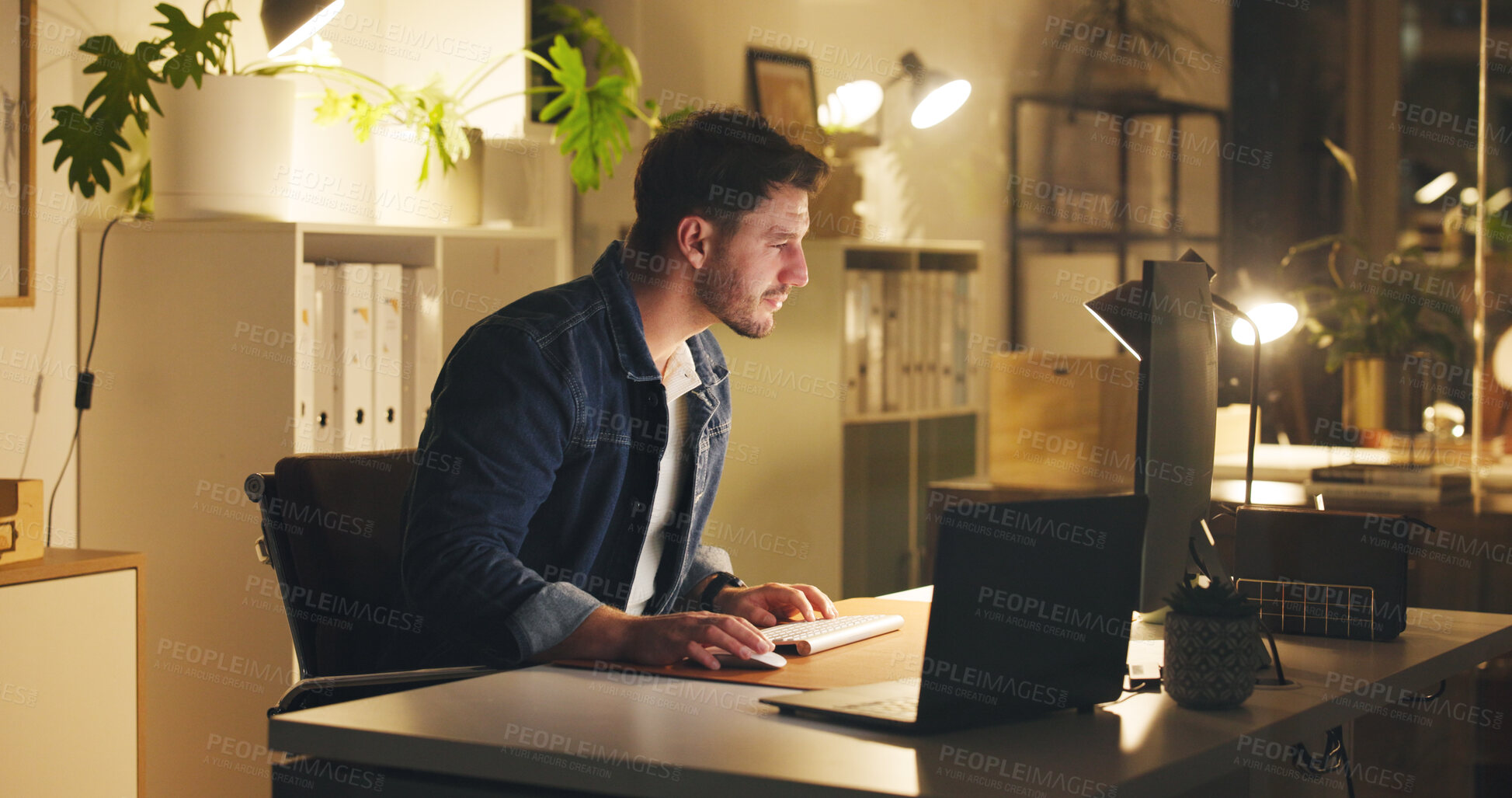 Buy stock photo Computer, reading and businessman in office at night for creative project with deadline. Technology, research and male magazine director working on article for publishing on website in workplace.