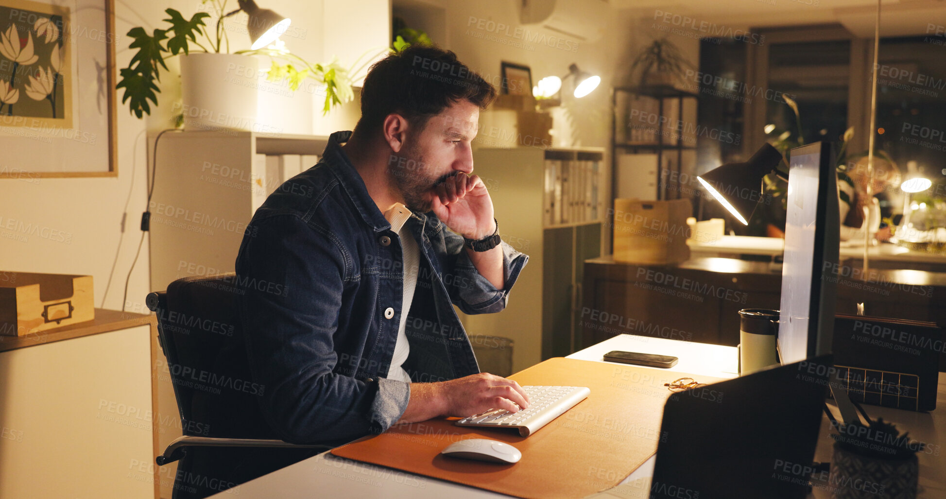 Buy stock photo Man, yawn and computer in office at night with burnout, work article and deadline. Tired person, overtime and tech for research, business info and exhausted for draft task in publishing company