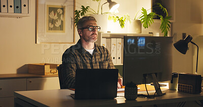Buy stock photo Computer, research and mature businessman in office at night for creative project with deadline. Technology, reading and magazine director working on article for publishing on website in workplace.