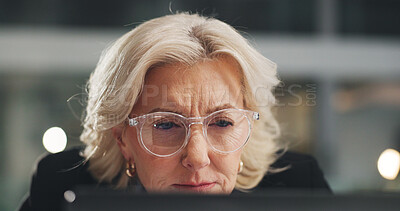 Buy stock photo Reading, mature and businesswoman in office with computer, research and review in financial audit. Thinking, glasses and female person in workplace with technology, finance report and evaluation