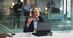 Woman, headset and laptop for video call at office for call, explain or consulting at insurance company. Mature person, broker and computer for virtual meeting, discussion or contact on web at agency