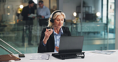 Buy stock photo Woman, headset and laptop for video call at office for talk, explain or consulting at insurance company. Mature person, broker and computer for virtual meeting on web, discussion or bokeh at agency