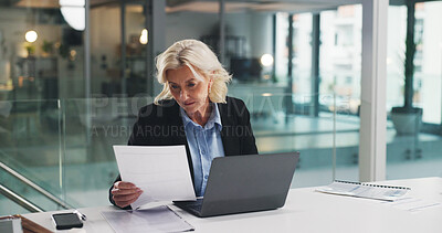 Buy stock photo Reading, business woman or paperwork with laptop for investment report, stocks evaluation or IPS. Portfolio manager, mature person and serious with document in office for economic data or performance