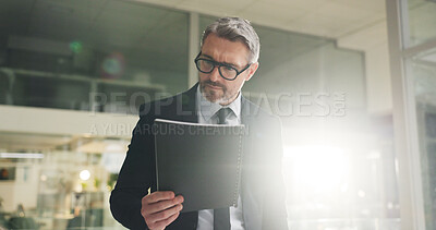 Buy stock photo Reading, document and mature businessman in office, working late or accountant with investment info. Serious, employee and person with paperwork for funding application, flare and deadline at night
