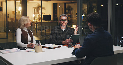 Buy stock photo Business, team and tablet in meeting at night for editorial planning, article ideas and feedback. Publishing agency, people and editor with discussion for story guidance, topics review and deadline