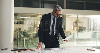 Buy stock photo Business, man or reading paperwork in office at night for finance analysis, planning or forecasting. Financial analyst, mature person and organize files for budget performance, evaluation or deadline