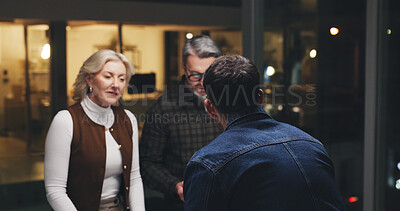 Buy stock photo Team, meeting and discussion at night, office and planning with insight, review or feedback at media company. Business people, startup and group for solution, talk or collaboration at creative agency