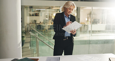 Buy stock photo Business, woman or reading paperwork in office at night for finance analysis, planning or forecasting. Financial analyst, mature person or organize files for budget performance evaluation or deadline