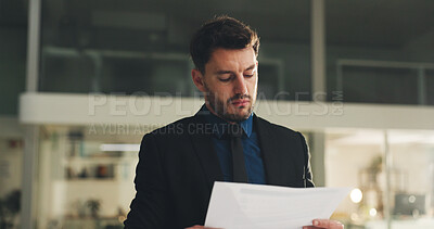 Buy stock photo Documents, reading and businessman in office at night with report for investment proposal. Paperwork, finance and male financial manager with planning for company budget with deadline in workplace.