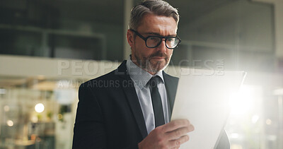 Buy stock photo Paperwork, reading and businessman in office at night with report for investment proposal. Documents, deadline and mature male financial manager with planning for company budget in workplace.