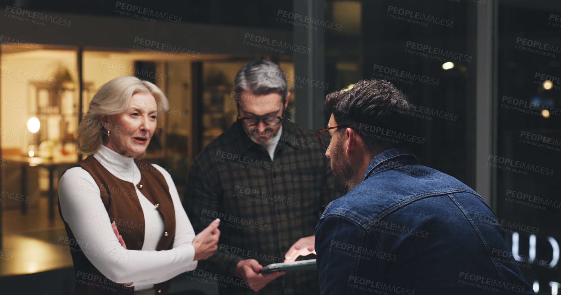 Buy stock photo Business people, tablet and collaboration at night for brainstorming, schedule or project deadline. Group, employees or team working late with technology for creative development or agenda in office