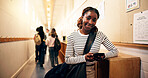 Student, girl and smartphone in hallway at high school for text message, social media or online portal for assessment. Person, teenager and mobile app for academic communication or email on campus