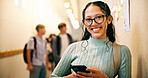 Happy, girl and phone in hallway at high school for text message, social media or portrait for learning. Female person, teen student and mobile app for academic communication or education on campus