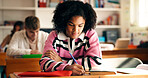 Girl, student and writing notes in classroom for education, lesson revision and quiz. Pupil, teenager and learning with high school assignment, study process and information for academic curriculum