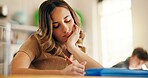 Thinking, girl and student writing in classroom for education, learning and studying burnout. Bored, teenager and notes with exam pressure, academic problem and learner laziness for school assignment