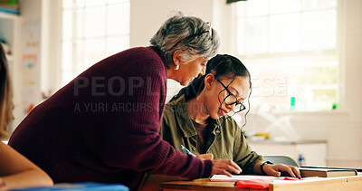 Buy stock photo Girl, student and teacher helping in classroom for education, lesson assistance and explain quiz. Learner, mature woman and learning support for assessment, problem solving tips and homework feedback