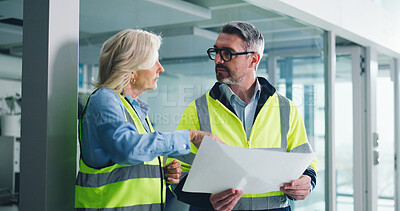 Buy stock photo Building, architect and team with blueprint, discussion or people with idea for property development. Real estate, man and mature woman with floor plan, engineer and collaboration for renovation