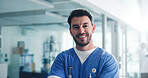 Man, portrait and nurse at hospital with smile for healthcare, advice or help with medical professional pride. Male person, health worker and scrubs for surgery, medicine and happy about us at clinic