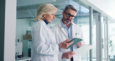 Buy stock photo Teamwork, tablet and help with doctors in hospital for healthcare report, research grant and planning. Medical case review, clinical guidelines and telehealth app with mature people for diagnosis