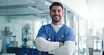 Happy, crossed arms and portrait of nurse in hospital with confidence for medical support career. Smile, professional and male healthcare worker from London with pride for nursing job in clinic.