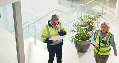 Buy stock photo Thinking, architect and man with blueprint for office renovation, construction and maintenance above. Mature engineer, floor plan and document for building, insight or problem solving with coworker