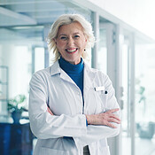 Woman, crossed arms and portrait of doctor in hospital with confidence ...