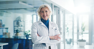 Buy stock photo Woman, crossed arms and portrait of doctor in hospital with confidence for medical support career. Smile, professional and mature female healthcare worker from London with pride for service in clinic